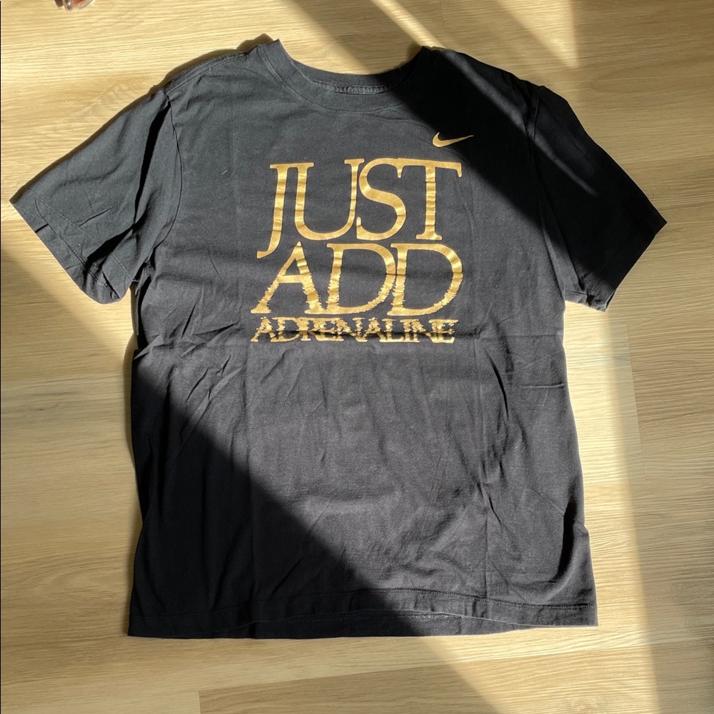 Nike Men’s Black T-Shirt with Gold 'Just Add Adrenaline' Graphic - Size M